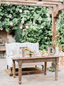 White elegant couch with decorated wooden table in Francisco Gardens