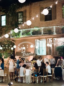 Francisco Gardens courtyard filled with people during a wedding event at night