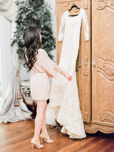 Bride getting ready and looking at bride dress